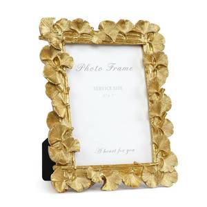 lot 3717 image: Cuspin 5x7 Picture Frame, Ornate Vintage Gold Photo Frame with Glass Front, Resin Ginkgo Leaf Textured Picture Frames for Tabletop or Wall Mount, Horizontal or Vertical