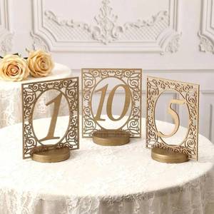 lot 27436 image: 10 Pcs Hand Painted Gold Wooden Table Numbers 1-10 Wedding Carving Table Numbers with Base Rustic Gold Elegant Desktop Sign for Wedding Reception Bridal Shower Banquet Centerpiece Decor - Retail $26