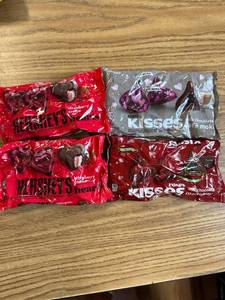 lot 6993 image: Four packages of assorted chocolates