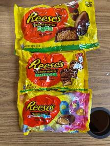 lot 6998 image: Three packages of Reese s eggs, bunnies, tie-dye eggs