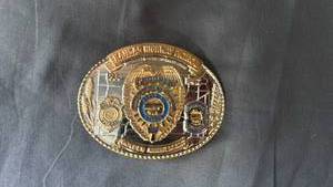 lot 98 image: Kansas Highway Patrol belt buckle Golden Anniversary