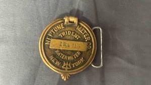 lot 100 image: Neptune Trident Meter Water Utility Brass Belt Buckle