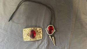 lot 102 image: Western Style Bolo Tie and Belt Buckle Set with Red Stones