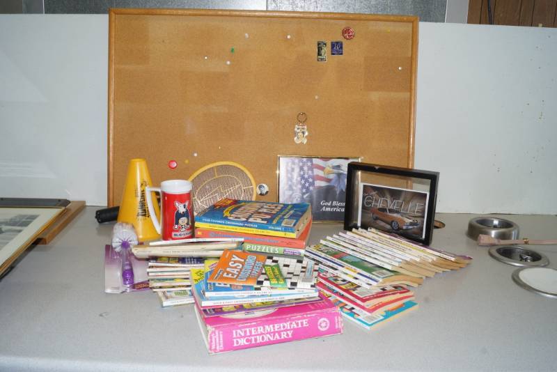 lot 1018 image: Elvis Pin, large lot of crossword puzzle books, office stuff and more