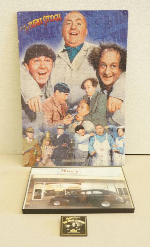 lot 1029 image: Three Stooges Puzzle and other Moes Memorabilia