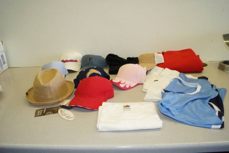 lot 1124 image: Nice Collection of Hats and Sport Shirts - New with Tags