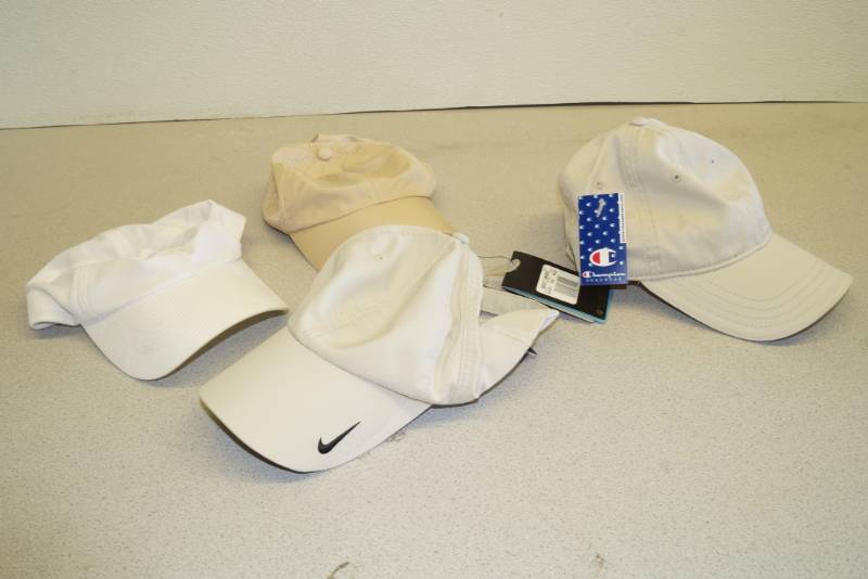 lot 1125 image: Nice Collection of Hats New with Tags - NIKE - Champion -