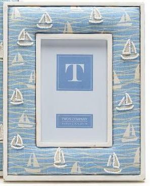 lot 1101 image: Twos Company Sailboat Hand-Beaded White Washed Photo Frame, Mango Wood, Cotton, Glass, and MDF, Stands Vertically and Horizontally Retail $30.95