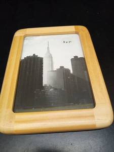 lot 1006 image: Framed Empire State Building NYC Skyline Photograph in Natural Wood Frame - Retail $15