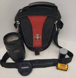 lot 13 image: TAMRON AF 75-300mm 14-5.6 LD Tele-Macro Photography Lense with Caps for NIKON AF, Roll of Unused Kodak 400 24 Exp. 35mm Color Print Film, and Wenger Padded Camera Case with Strap