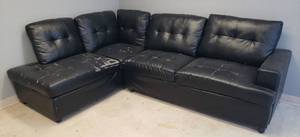 lot 20 image: Black Sectional - 2 Pcs with Removable Pillow Backs - Each Piece 34in D Seat - 70in L - 18in H Seat - 37in T Back - #105