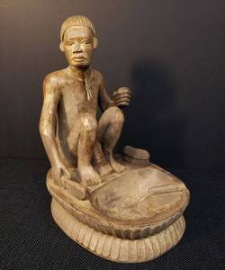 lot 21 image: Vintage Hand Carved African Tribal Folk Art Ash Tray Sculpture - Original Paper Sticker on Bottom Ifugao Wine Maker - Owner Purchased in 1973 - 8.5in T x 6in D x 5in W