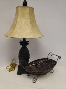 lot 23 image: Bronze Finish Pineapple Table Lamp with Faux Leather Shade - 27in T x 14.5in W, and Scroll Metal & Wicker Console Basket Bowl - 17in L x 8in W x 7in T