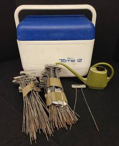 lot 28 image: Large Lot of Metal Garden Plant Identification Stakes, Vintage Watering Can, and Gott Tote 12 Cooler