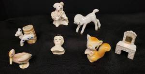 lot 64 image: Vintage 1950s Hand Painted Porecelain and Ceramic Miniatures Squirrel, Deer Vase, Pelican, Poodle with Violin, Horse, Doll Head, & Vanity Dresser - Tallest is 2.5in T