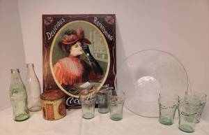 lot 68 image: Vintage 1979 & 1993 Coco-Cola Collectible Bottles, Set of Six 4in Green Glass Tumblers, Vintage Style Coca-Cola Advertising Metal Sign 12.5in W x 16in T, Vintage CanisterTin, and Coke Bottle Embossed Serving Bowl - 10in W x 6in T