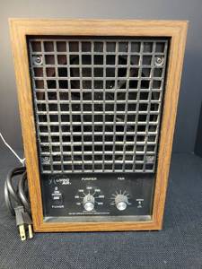 lot 95 image: Living Air - Air Purification Systim - Model #XL - in Faux Wood Cabinet - 8.in W x 12.25in T x 9.75in D - Made in USA  - Powers On
