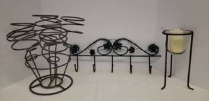 lot 135 image: Metal 6 Bottle Table Top Wine Rack 13in T x 15in W, MetalGlass Table Top Lantern with BO Candle 10.5in T x 6in W Base, and Verdi Metal Oak Leaf Wall Hooks 20in L x 7.5in T