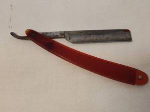 lot 146 image: Vintage Canton Cutlery - Canton, O.- Folding Straight Razor with Translucent Red Handle - Stamped #N9-7 Made in USA - Circa 1920s-1950s - 9.75in L Full Open