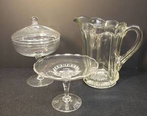 lot 162 image: Vintage US Glass Colonial Scalloped 8 Panel Heavy MilkWater Pitcher - 8.5in T x 8.5in W -  Vintage Blown Crystal Lidded Pedestal Candy Dish 8.75in T x 6in W, and Crystal Pedestal Tid-Bit Tray 4.75in T x 6.5in T