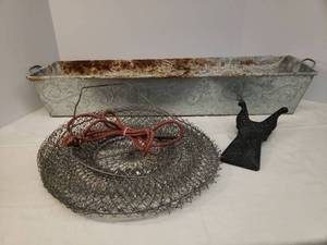 lot 172 image: Galvanize Embossed TroughPlanter with Handles 31in L x 7.5in W x 5in T, Vintage Collapsing Wire Fishing Catch Basket with Tie Down Cord & Stake, and Cast Aluminum Boot Jack