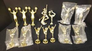 lot 16 image: NewUnsuded Gold Cheerleading Trophy Top Figurines - 14Pcs - Most still sealed in Original Pagages - Tallest is 6in T - Includes AkroBins Storage Bin