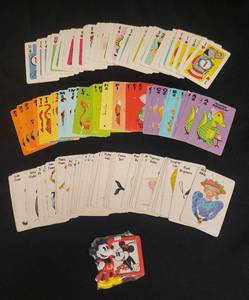 lot 28 image: Vintage 1960s Whitman Animal Rummy Card Game #4908, Vintage Old Maid Card Game Cards, Vintage 1951 Whitman Crazy 8s Card Game Cards, and Sealed Mickey Mouse Magnetic Mini Picture Frame