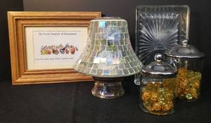 lot 36 image: Glade Scented Oil Candles & Holders, Mosaic Glass Jar Candle Shade, Oak Framed The Seven Dwarves of Menopause Print, 7.5in T x 9.5in W, Vintage Glass Tray, and Pair of Metal Lidded DecorStorage Jars with Glass Marbles