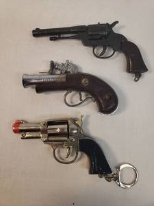 lot 46 image: Vintage 1960s Nichols Buccaneer Cap Gun 3.5in L, Vintage Metal 45 Cap Gun Toy 4.5in L, and Vintage Silver Pistol Cap Gun Key Ring 3.5in L