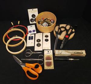 lot 52 image: Collection of Vintage Sewing Supplies German Embossed EmbroideryNeedlework Scissors - Stamped, Antique Buttons, Embroidery Hoops, Fleishers Rug & Embroidery Punch Needle in Original Box, Pack of Needles, Finishing Scissors, and 3 Fabric Shears
