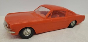 lot 73 image: Vintage 1965 Mustang Fastback Toy Car - by Processed Plastic Company - 125 Scale - WindowInterior Intact - Wheels Move - Chrome Color Shiney - Detailed Undercarriage - in Good Shape for 60 YO