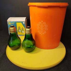 lot 87 image: Vintage 1970s Tupperware Orange Servalier Canister #807-13 with Lid, Vintage Rubbermaid 1970s Harvest Gold Lazy Susan #JB1-2709-13 - 10.5in W, and Vintage 1960s Westwood Bright Idea Green Glass Light Bulb Salt & Pepper Shaker set with Original Box