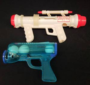 lot 88 image: Vintage 1970s Kusan Inc. Astro Zapper Ball Launcher Gun - #64B - 12.5in L and Vintage Spring Action Ball Launcher Gun with Balls 7.25ini L
