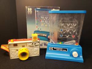 lot 95 image: Vintage 1976 Tomy Toys - The Wonderful Waterfuls Tic-Tac-Toe Game - in Oringal Box, and 1967 Fisher-Price Picture Story Camera #784 - Works as should - in Nice Shape for Age