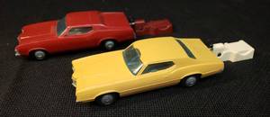 lot 103 image: Pair of Vintage 1970s Proctor & Gamble Funmate Go Cars Toys 5in L - with Spring Action Launching Tools Candy Apple Red Mercury Cougar & Tan Ford Thunderbird