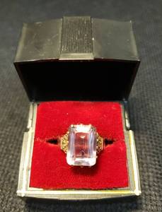 lot 116 image: Antique 10K Rose Rolled Gold Ring - with Large Amethyst Color Stone - Engraved Design on Shoulders of Band next to Stone - Maker Stamp inside - Has been cut on bottom of Band - Size 6-6.5