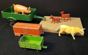 lot 130 image: Vintage SLIK-TOY Aluminum 2 Wheel Farm Trailer - 6in L x 3.25in w, Midge Toy Die-Cast Metal Train Car, 1969 Tootsie Toy Die-Cast Metal Stake Trailer, and Vintage Plastic Farm Animal Figurines Boar Hog, Bull, Calf, & Billy Goat