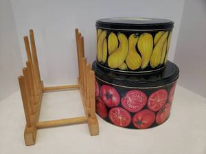 lot 156 image: Vintage Department 56 Garden Tin Canister Set - Largest is 10in W x 6in T, and Pampered Chef Wood Plate Rack 12in L x 7in D x 9.5in T