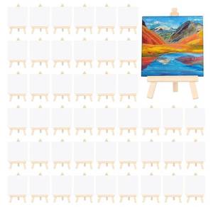 lot 37494 image: 80 Pcs Mini Canvas and Easel Set for Painting Canvas Panels with Wooden Easels for Oil Acrylic Painting Mothers Day Birthday Party Favors(4 x 4 Inch) - Retail $40
