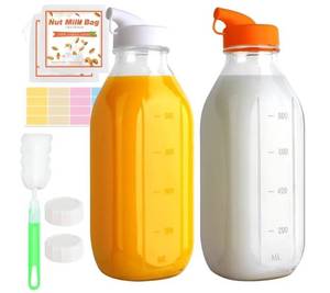 lot 37513 image: 32 Oz Glass Milk Bottles, 2 Pack Scale Mark Drinking Jug with 2 Nut Milk Bags& Airtight Screw Lid & Silicone Pour Cap& Stickers, 1 Quart Reusable Juice Bottle Water Pitcher for Coffee Yogurt - Retail $16