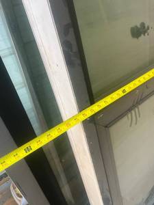 lot 511 image: Two sliding patio doors and one set French doors