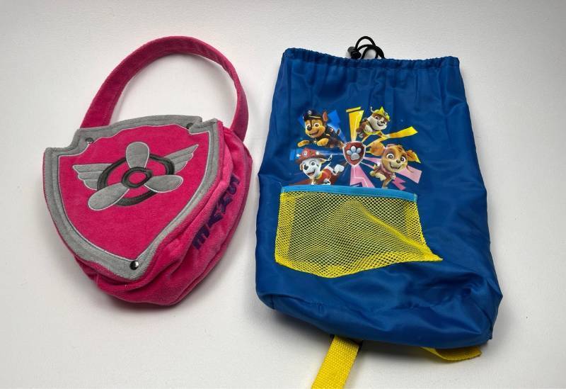 lot 164 image: Paw Patrol Pink Skye Shield Bag and Blue Drawstring Backpack Set