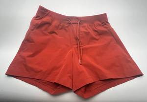 lot 111 image: Lululemon Red Athletic Shorts Mens Large 5-inch