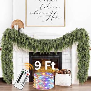 lot 23894 image: Cedar Christmas Garland with Lights for Mantle - Decorations 9ft Realistic Lighted Faux Pine Garlands for Xmas Home Decoration Indoor Stairs Railing Fireplace Outdoor 9 ft Prelit Garland Door Decor - Retail $60