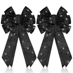 lot 23908 image: Giegxin 2 Pcs Large Black Lighted Christmas Bows with Lights for Wreath and Tree Topper, 18x10 Inch Pre Lit Black Wreath Bow Light up for Christmas Decorations for Front Door Windows Outdoor Indoor - Retail $17