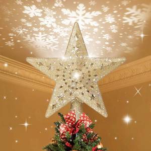 lot 31224 image: BLOOMWIN Christmas Tree Topper Lighted with Snowflake Projector, LED Rotating Hollow Snowflake, 3D Glitter Lighted Gold Star Tree Topper for Xmas Tree Festival Decorations Lights - Retail $29
