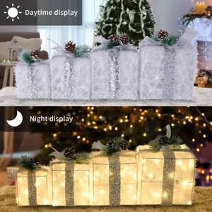 lot 19488 image: COVFEVER Set of 4 Christmas Lighted Gift Boxes, Pre-lit Light up Present Set with Different Sizes for Holiday Indoor Outdoor Decorations - Battery Operated(Warm White) - Retail $36