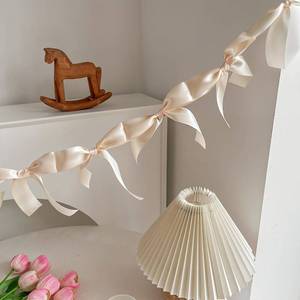 lot 2209 image: Eanjia Pre-Assembled Champagne Gold Bow Garland - 6ft Luxury Wedding Decor, Anniversary and Bridal Shower Banner, Thick Silk Satin No DIY Needed (Champagne, 6ft)