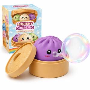 lot 2220 image: Dumpling Squishy Mystery Box - Squishy Dumpling with Bubble Blowing Feature, Bao Bun Stress Relief Toy, Soft Sensory Fidget Squeeze Toy with Steamer Box, Cute Desk Gift (Purple)