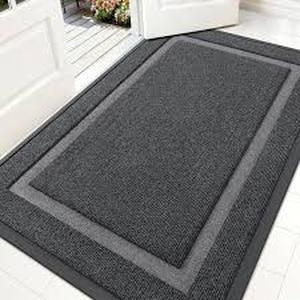 lot 2115 image: Black doormat approximately 2 ft by a foot and a half